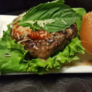 All beef meatball patty mixed with garlic, red onion and Italian herbs. Topped with Marinara Sauce, Basil &amp; Parmesan Cheese.