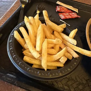 a tray of fries and a bowl of soup