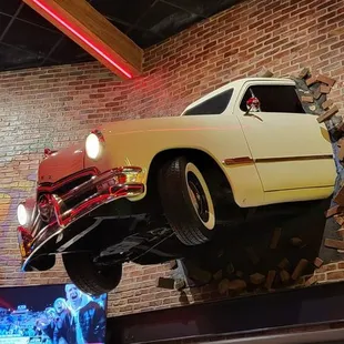 a car hanging from the ceiling