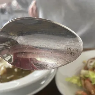Dirty spoon.  It was replaced upon request.