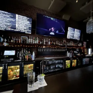 a bar with a lot of menus on the wall