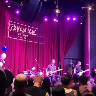 a band performing on stage