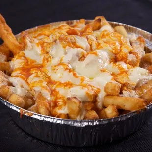 T-Bird Fries- hot sauce on french fries with grilled chicken chunks, ranch dressing, with mozzarella cheese baked on top