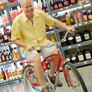 a man riding a bike in a store