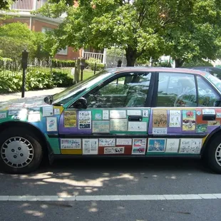 tour guide's car papered with funny papers