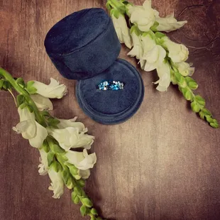Blue topaz ring from Thurber Jewelers, featuring London, Swiss, and Sky Blue topaz with diamond accents.