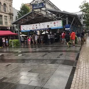people walking in the rain