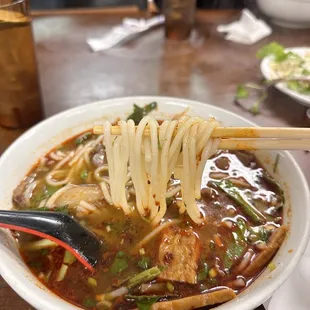 a bowl of soup with noodles