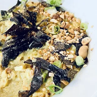 Curried Seaweed $9.95 Diced tofu and mushrooms, sautéed with seaweed in a coconut curry sauce. Served with sesame rice crackers.