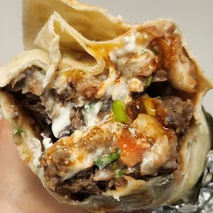 Carne asada burrito, extra meat, no rice.  $16.75. July 2023.