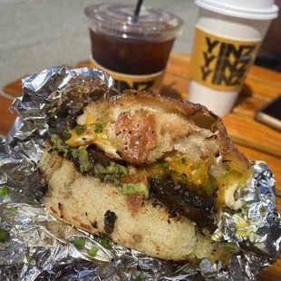 Roasted portobellos, cheddar, avocado spread, cherry pepper mayo, and a fried egg on a poppyseed kaiser roll