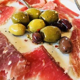 Olives and Spanish ham.