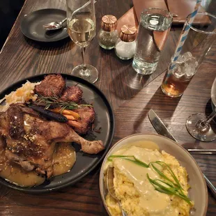 Confit half chicken with a side of cheesy grits