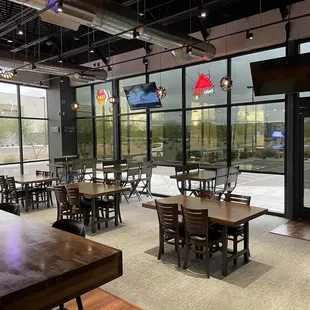 a dining area with tables and chairs