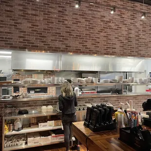 a woman working in a restaurant kitchen