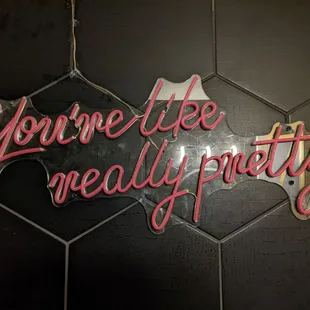 a neon sign that says you&apos;re really pretty