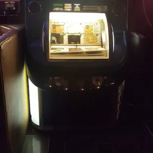 a jukebox in a dimly lit room