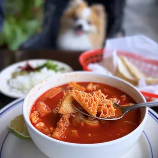 Large Menudo w/ pata, hominy, and choice of corn or flour tortillas | $16