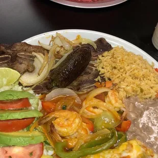 Tia letys plate. Has carne asada and a Chile relleno. With rice and beans and salad.