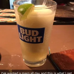9$ margarita in a bud light glass made with well tequila. ruined date night. we&apos;re breaking up now. Thanks tia.