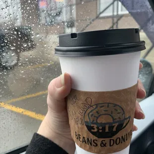 Tia's is the name on the outside but Beans and Donuts is the name on the coffee sleeve