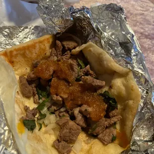 Asada taco with cilantro an onion