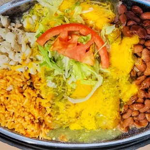 a bowl of rice, beans, and tomatoes