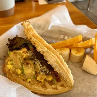 Waffle Breakfast Spicy scrambled egg, tofu, Avocado, bacon bits with side of fruits