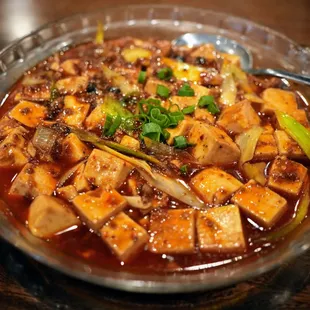 Chengdu Ma Po Tofu (老成都麻婆豆腐): silken tofu, ground pork, leeks, spicy Sichuan peppercorn hot sauce ($16.99).