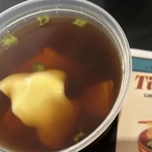 Wonton soup with brown broth I&apos;ve never seen before. Wasn&apos;t too bad.