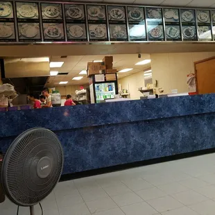 a fan in front of the counter