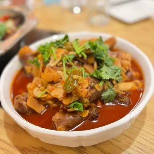 a bowl of stew with meat and vegetables