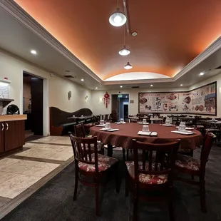 a dining room with tables and chairs