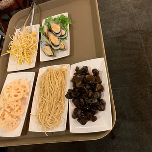 Hot pot ingredients-- bean sprouts, mussels, mushrooms, noodles, lotus root
