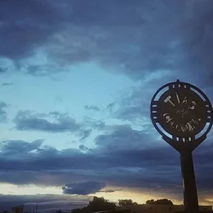 a clock in the middle of a street