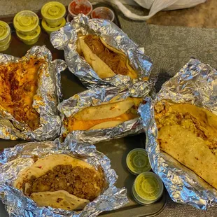 Ultimo(Sausage, chorizo, bacon, egg), migas, brisket, picadillo and bacon, potato and egg