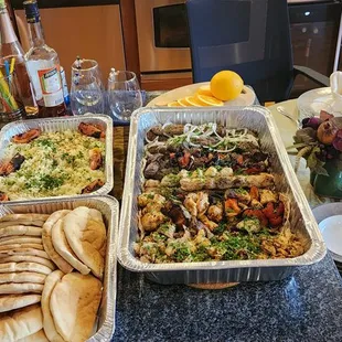 yellow rice, pita bread, steak, chicken and kifta kabobs,chicken shawarma