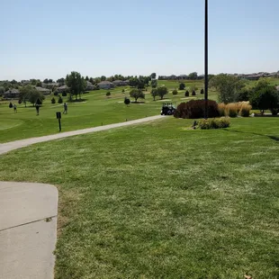 a golf course with a flag pole