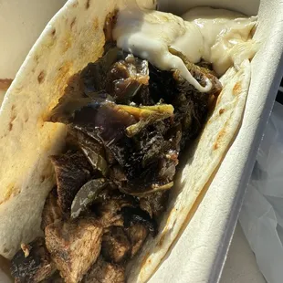 Philly taco.  Cheese slid to the side.  But there was a lot of it.