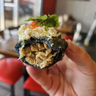 Inside profile of blue corn carnitas-stuffed quesadilla