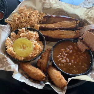 Ribs, pulled chicken, brisket, bbq beans, red slaw, hush puppies.