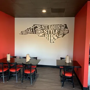 a dining room with red walls