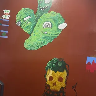 a green monster and a skull