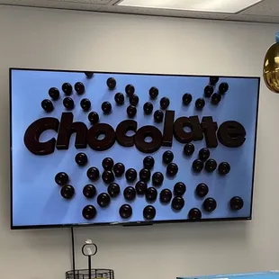 chocolate covered donuts on display