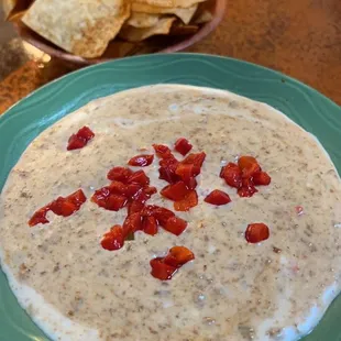 a bowl of dip and chips