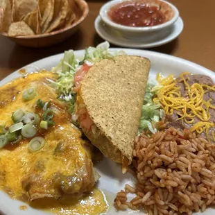 Choice of 2 Items Combo Plate. Chicken &amp; Cream Cheese Enchiladas and chicken Taco with rice and beans as a side.