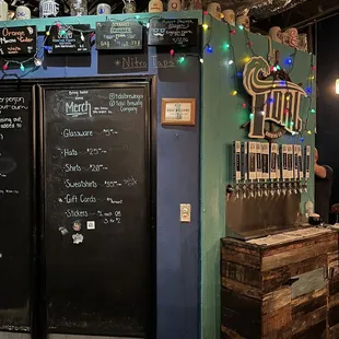 a man standing in front of a blackboard