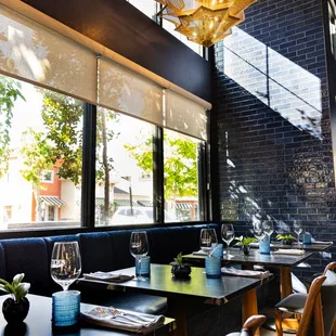 a dining area with tables and chairs