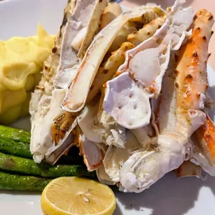 Crab legs mashed potatoes and asparagus