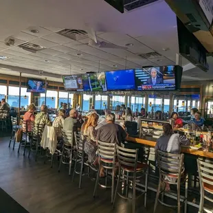 people sitting at the bar